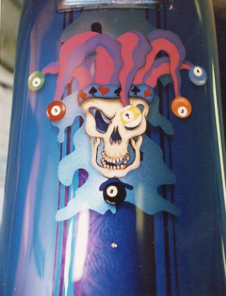 skulled jester with pool balls